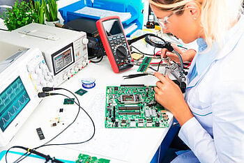 A lab engineer testing electronic circuits