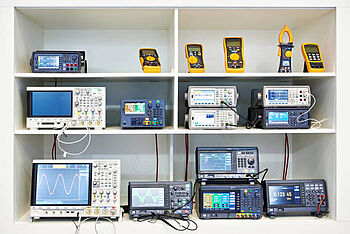 A range of various sized oscilloscopes and other electronic measuring devices